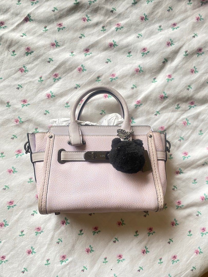 Coach x Ariana Grande Kiti Swagger (Category: Purses & Pouches) located in Paranaque City. Submitted by fancyshit (Listing ID 1386972183, Image 1). Description: RARE Coach x Ariana Grande Kiti Swagger - limited edition - only a limited number of these bags were created - Needs deep cleaning because of stains from storage - Signs of usage - bought direct from coach website - complete with charms and pompom MOP: BDO/Security Bank MOD: GGX/Lalamove.