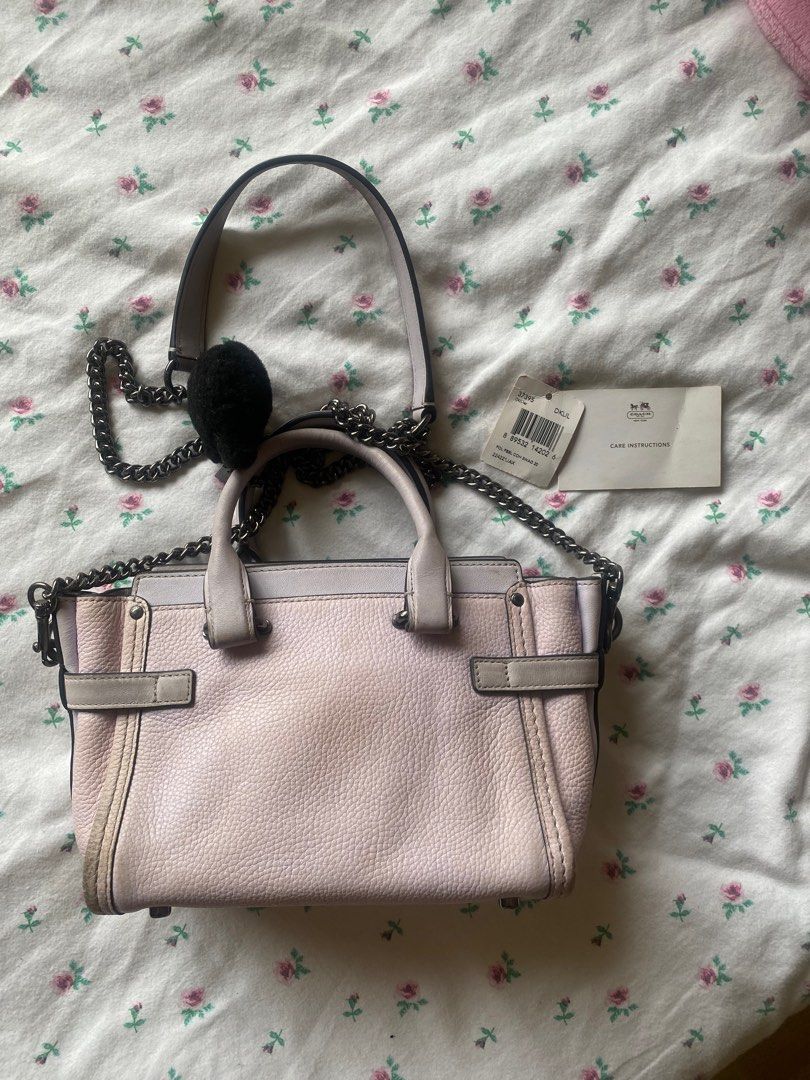 Coach x Ariana Grande Kiti Swagger (Category: Purses & Pouches) located in Paranaque City. Submitted by fancyshit (Listing ID 1386972183, Image 3). Description: RARE Coach x Ariana Grande Kiti Swagger - limited edition - only a limited number of these bags were created - Needs deep cleaning because of stains from storage - Signs of usage - bought direct from coach website - complete with charms and pompom MOP: BDO/Security Bank MOD: GGX/Lalamove.