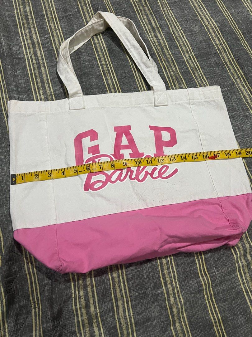 GAP x Barbie Pink Large Tote Bag (Category: Tote Bags) located in Cavite. Submitted by charlotte_alexandra16 (Listing ID 1386984024, Image 3). Description: No issues, just needs a good wash. Can fit up to 15inch laptop, measured length and width when flat on ground (see uploaded photos) .