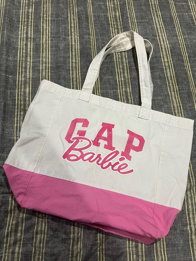 GAP x Barbie Pink Large Tote Bag (Category: Tote Bags) located in Cavite. Submitted by charlotte_alexandra16 (Listing ID 1386984024, Image 2). Description: No issues, just needs a good wash. Can fit up to 15inch laptop, measured length and width when flat on ground (see uploaded photos) .