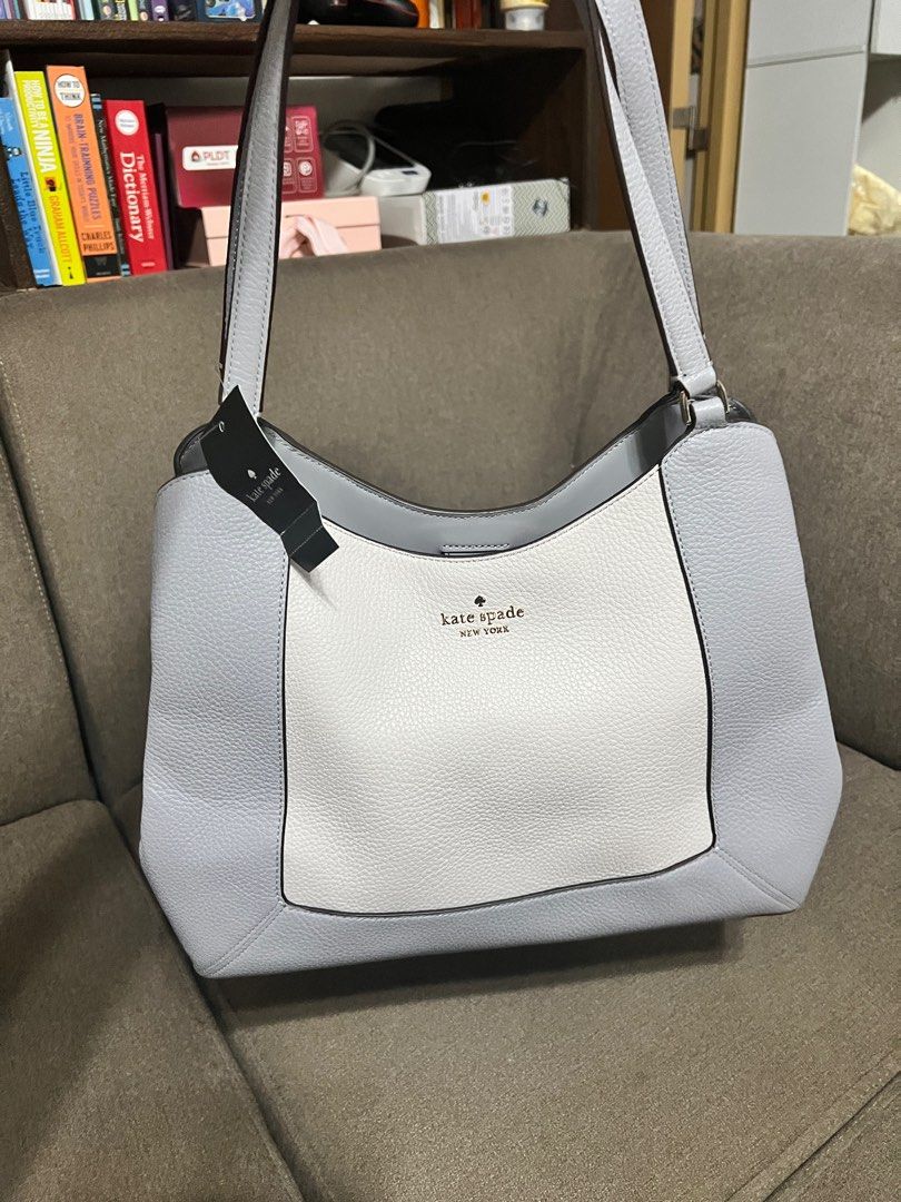 Kate Spade Lena Triple Compartment - Gray (Category: Luxury Bags & Wallets) located in San Pedro. Submitted by misslumi (Listing ID 1386969695, Image 3). Description: Brand New from US! Measurements Length: 13.2" Height: 11.12" Width: 5.2" Materials Pebbled Leather Two way script logo lining Handle Handle drop: 12" Strap Strap drop: 22" Features Middle zip compartment Back zip pocket Snap closure Metal pinmount with spade logo Dust Bag Included: 