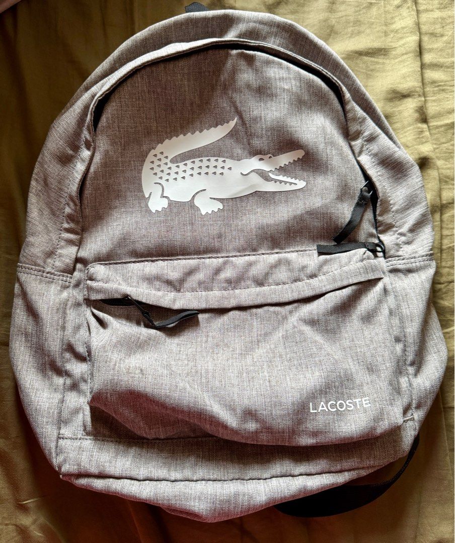ORIGINAL Lacoste Gray Backpack bag with Laptop Pocket (Category: Backpacks) located in Quezon City. Submitted by kryshnanzyanna (Listing ID 1386985533, Image 2). Description: ORIGINAL Lacoste Gray Backpack bag with Laptop Pocket.