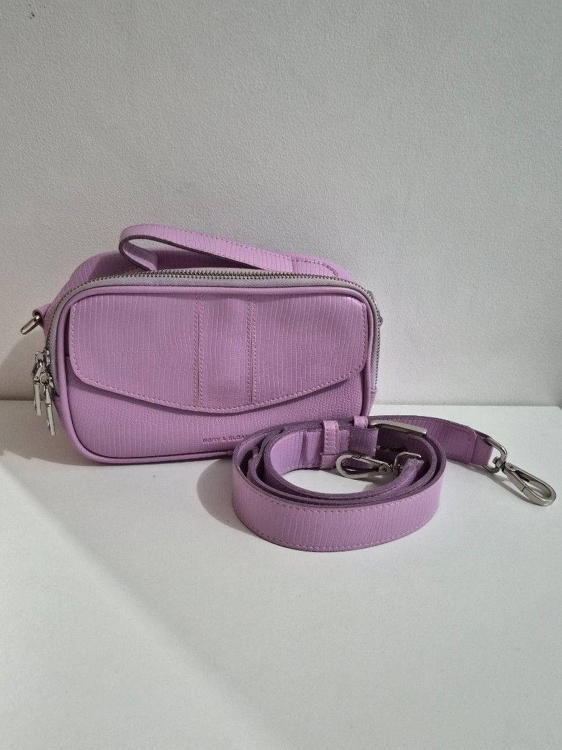 Rory and Sloan Lilac Bag (Category: Cross-body Bags) located in Mandaluyong City. Submitted by ninadeclutterz (Listing ID 1387031749, Image 1). Description: Rory and Sloan Bag - Comes with a body strap - Comes with original dustbag Original price: around Php 3500 Selling price: Php 900 Payment: Gcash, BPI Shipping c/o buyer: J&T, Lalamove, Grab Delivery.