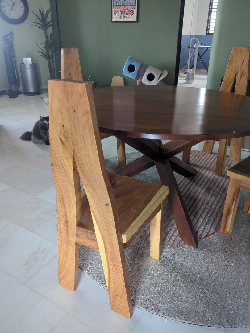 Solid Wood Dining Table Set (Category: Tables & Sets) located in Singapore. Submitted by nanafana93 (Listing ID 1387007053, Image 3). Description: - Solid wood dining table set - Includes round table with starburst base - Matching chairs included - Rich, dark wood finish - Perfect for dining room or kitchen Selling separately if you want too. Table: $800 Chair: $80.