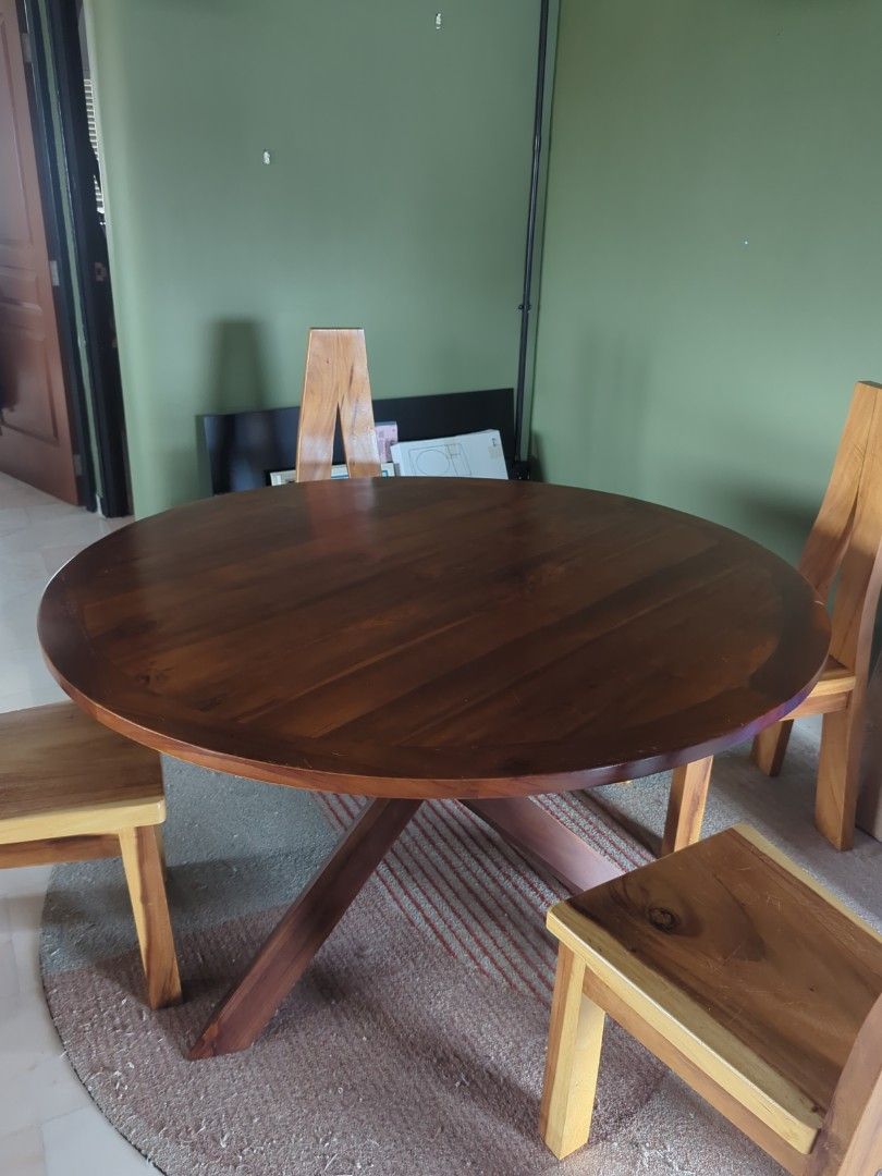 Solid Wood Dining Table Set (Category: Tables & Sets) located in Singapore. Submitted by nanafana93 (Listing ID 1387007053, Image 2). Description: - Solid wood dining table set - Includes round table with starburst base - Matching chairs included - Rich, dark wood finish - Perfect for dining room or kitchen Selling separately if you want too. Table: $800 Chair: $80.