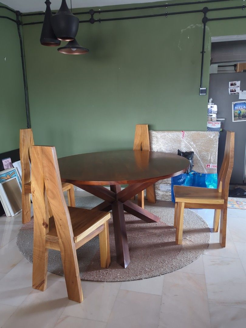 Solid Wood Dining Table Set (Category: Tables & Sets) located in Singapore. Submitted by nanafana93 (Listing ID 1387007053, Image 1). Description: - Solid wood dining table set - Includes round table with starburst base - Matching chairs included - Rich, dark wood finish - Perfect for dining room or kitchen Selling separately if you want too. Table: $800 Chair: $80.