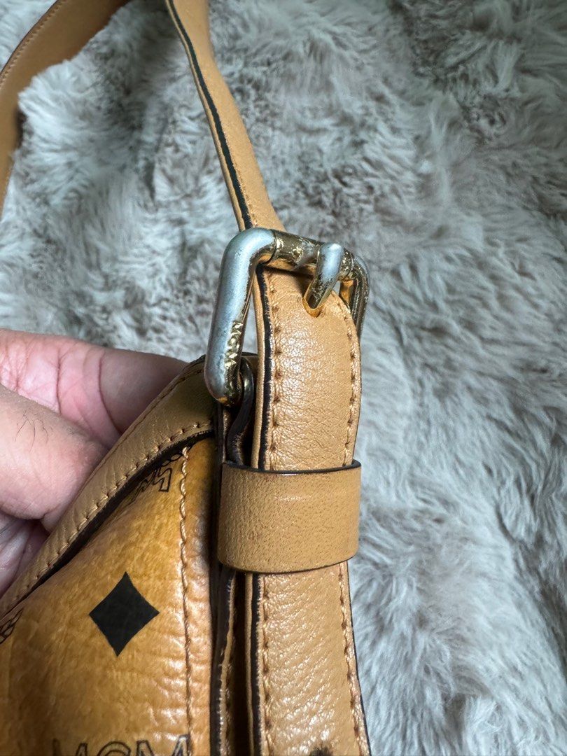 AUTHENTIC MCM SLING BAG (Category: Luxury Bags & Wallets) located in Santa Rosa. Submitted by rjaarmblo (Listing ID 1387266662, Image 2). Description: AUTHENTIC MCM SLING -Preloved but in very good condition -Guaranteed authentic -Vintage MCM; Made in Germany -Has faded parts of the metal but doesn’t affect use of the bag.
