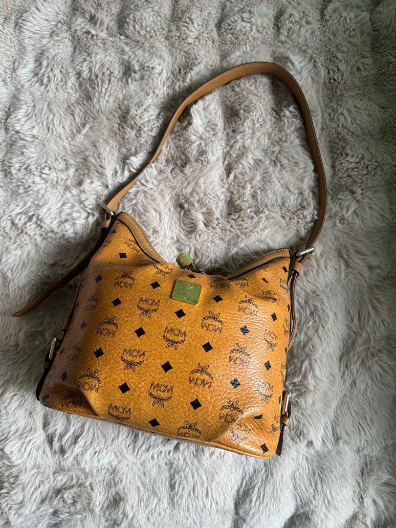 AUTHENTIC MCM SLING BAG (Category: Luxury Bags & Wallets) located in Santa Rosa. Submitted by rjaarmblo (Listing ID 1387266662, Image 1). Description: AUTHENTIC MCM SLING -Preloved but in very good condition -Guaranteed authentic -Vintage MCM; Made in Germany -Has faded parts of the metal but doesn’t affect use of the bag.