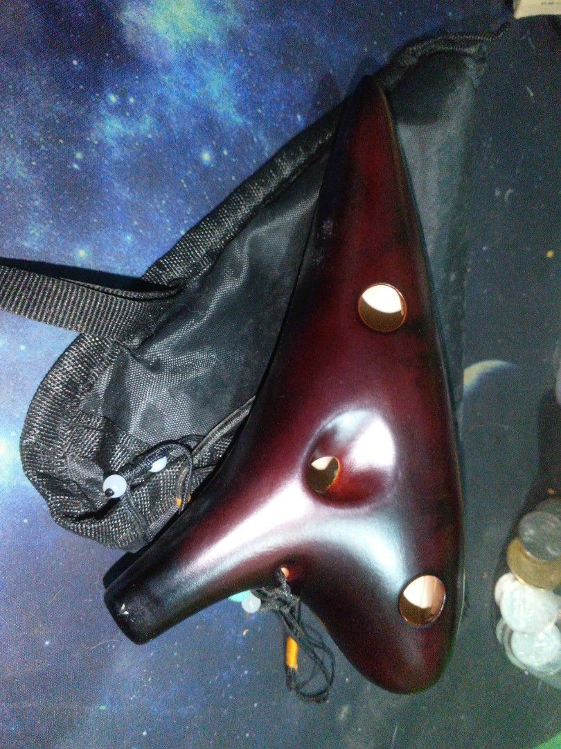 Ceramic 12-Hole Ocarina (Category: Musical Instruments) located in Muntinlupa City. Submitted by kittymeowcute (Listing ID 1387293432, Image 2). Description: 12 Hole Ceramic Alto Ocarina Good for Beginners. no dents, no damages, no scratches. Lightly Used. Good as new. used not abused..