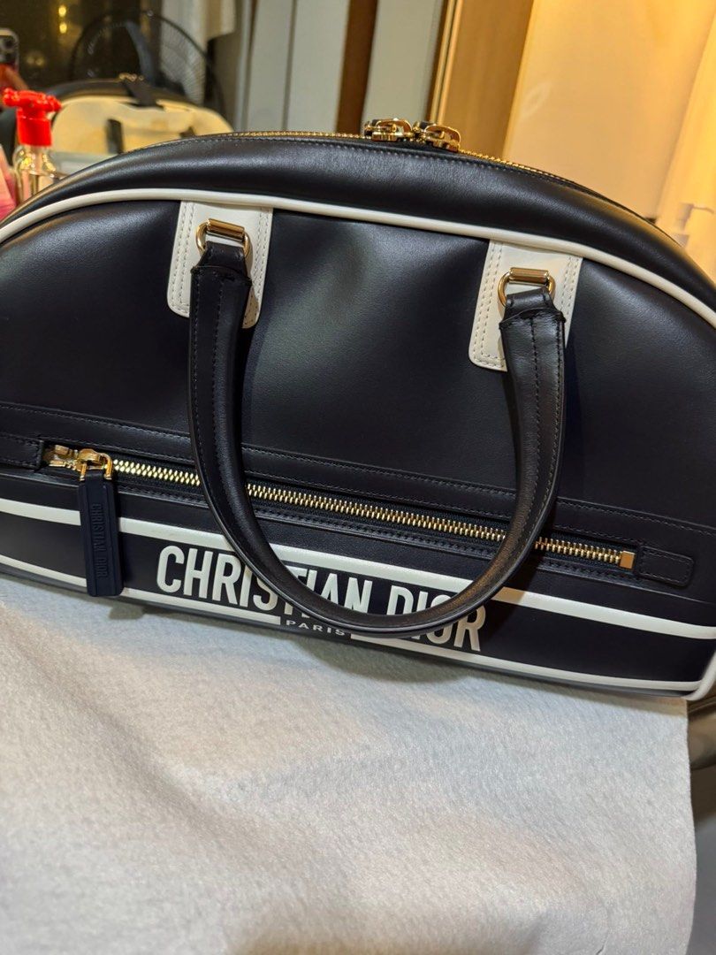 Christian Dior Vibe Zip Bowling Bag (Category: Luxury Bags & Wallets) located in Quezon City. Submitted by moniquesanchez (Listing ID 1387273218, Image 1). Description: Decluttering! Lowered the price :) Used literally once during trip in germany Large, Black color, 2nd photo is only size reference when being bought Store bought 120k Personally owned/1st owner More photos available upon request RFS: Size not suitable for me, decluterring .