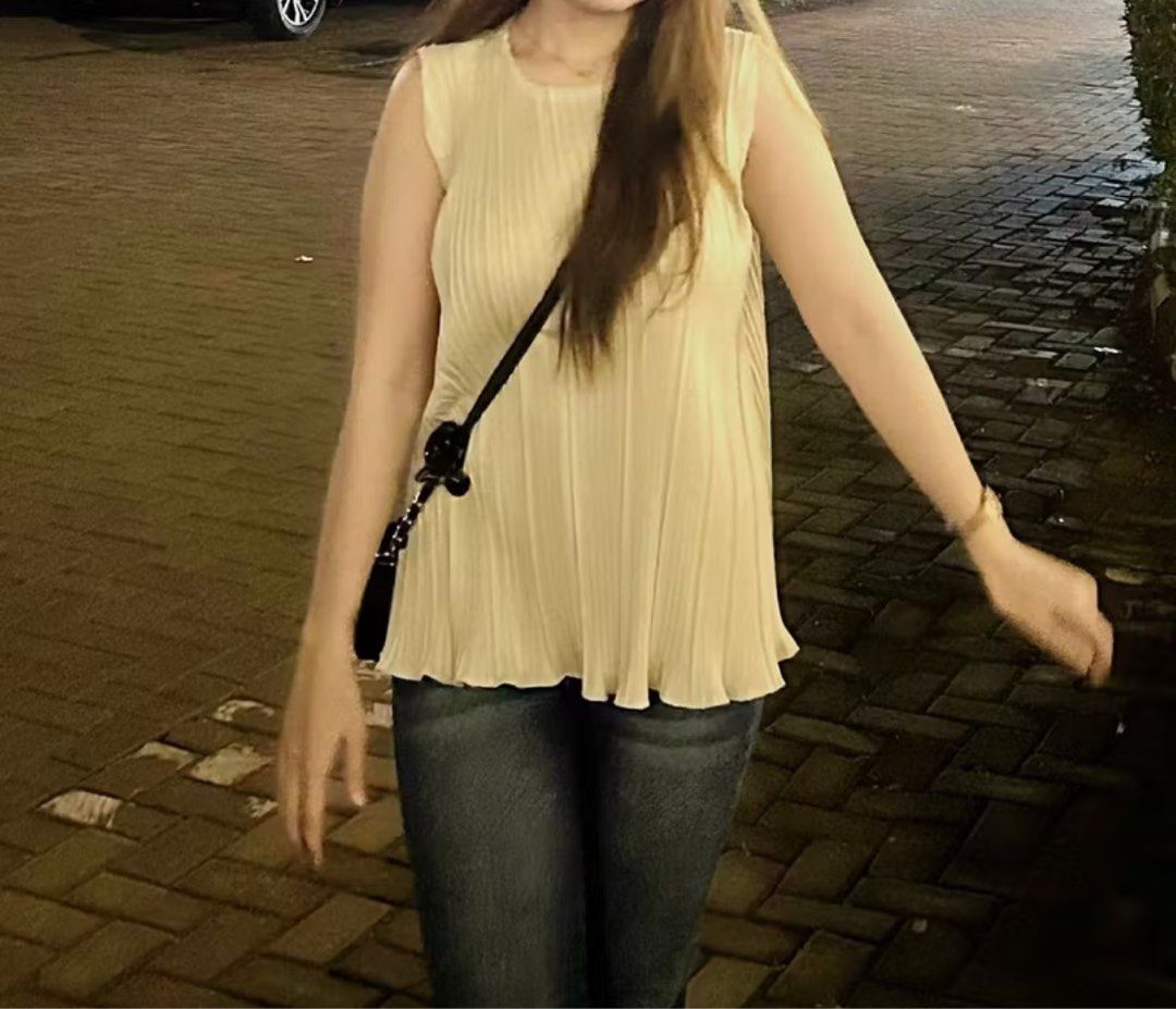 Cream A Line Top (Category: Sleeveless) located in Taguig. Submitted by _handydandy (Listing ID 1387205830, Image 1). Description: - classy interfolded sleeveless top - fits xs to semi medium frames - no flaws; never worn - rfs: was supposed to wear for an event but went with another outfit instead.