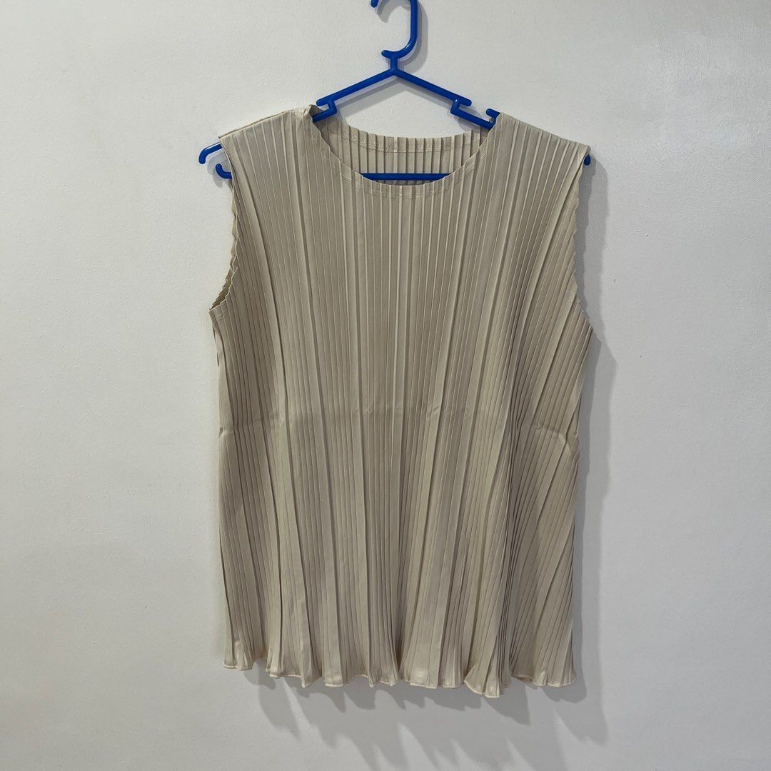 Cream A Line Top (Category: Sleeveless) located in Taguig. Submitted by _handydandy (Listing ID 1387205830, Image 2). Description: - classy interfolded sleeveless top - fits xs to semi medium frames - no flaws; never worn - rfs: was supposed to wear for an event but went with another outfit instead.