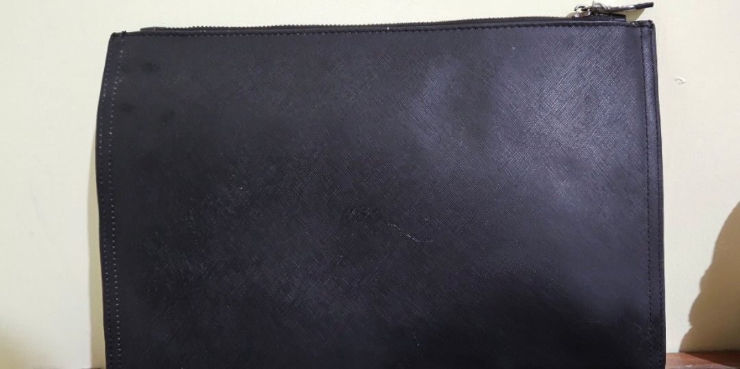 Givenchy Clutch bag (Category: Luxury Bags & Wallets) located in Bauko. Submitted by callwan24792 (Listing ID 1387181307, Image 3). Description: Elegant and timeless, this clutch bag is perfect for both day and evening use. Crafted with Givenchy’s signature sophistication, it features a sleek silhouette that easily complements any outfit. This piece shows signs of usage such as light wear on the material and edges, but remains in good overall con