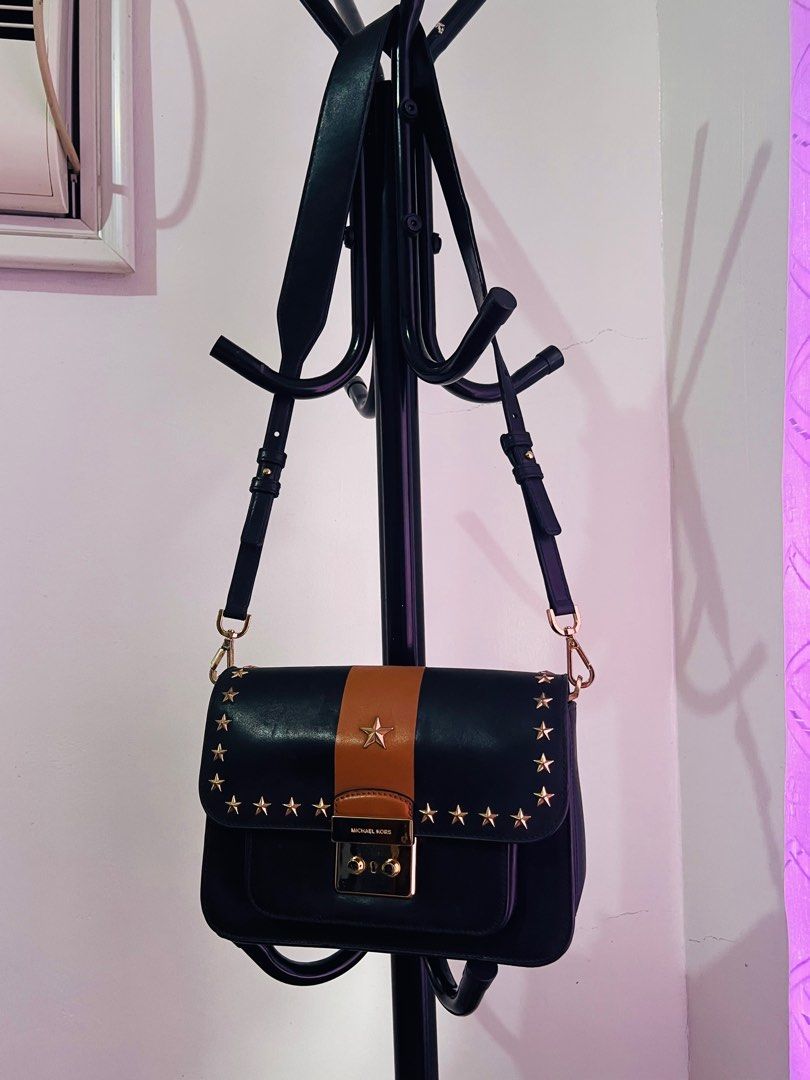Michael Kors Sloan Editor Studded Leather Shoulder Bag (Category: Luxury Bags & Wallets) located in Santiago. Submitted by mariesimon (Listing ID 1387197996, Image 3). Description: 9”L x 6-1/2”H x 2-1/2”W (width is measured across the bottom of handbag); 1.37 lbs. approx. weight 15-1/2”L to 18”L removable strap Push-lock closure Gold-tone exterior hardware, 1 open compartment & 1 back snap pocket 1 interior zip pocket & 3 front pockets Leather.