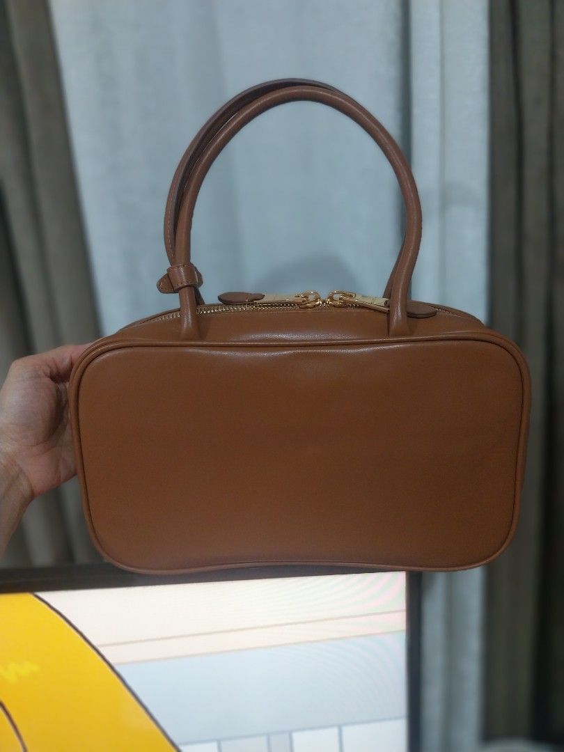 MIU Cognac Beau Bag (Category: Shoulder Bags) located in Quezon City. Submitted by jonvee2000 (Listing ID 1387283032, Image 2). Description: Excellent condition small size/shoulder bag made in Italy/white tag/lampo with dustbag/care card embossed logo name.