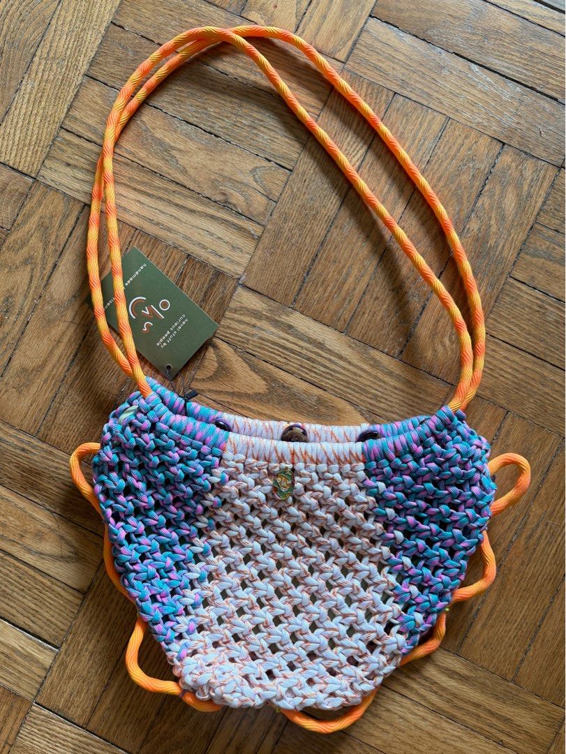 Ola Haus El Cangrejo (Category: Cross-body Bags) located in Manila. Submitted by donna___ (Listing ID 1387222358, Image 1). Description: A light sling bag you can wear around your body or on your shoulder. It's really up to you but more than that, the details on this new shape must be seen up close :) approximate size body: 8 inches x 14 inches strap drop: 16 inches each bag is unique and measurements may vary slightly.
