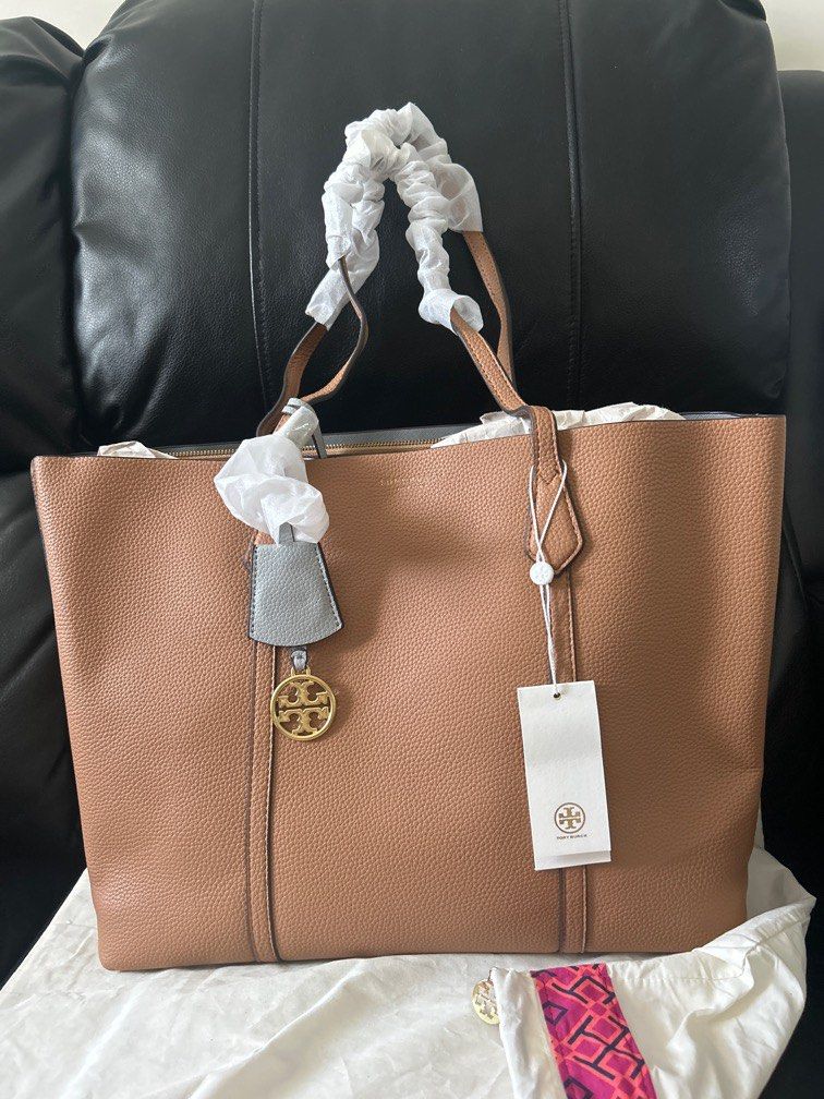 Tory Burch Perry Canvas Triple-Compartment Tote (Category: Luxury Bags & Wallets) located in Pasig City. Submitted by TheApparels_ph (Listing ID 1387202317, Image 1). Description: COLOUR: Light Umber/Brown MATERIAL: Pebbled Leather SIZE: L36 X W13.5 X H29 (CM)/ LARGE * Series : PERRY TRIPLE-COMPARTMENT TOTE.