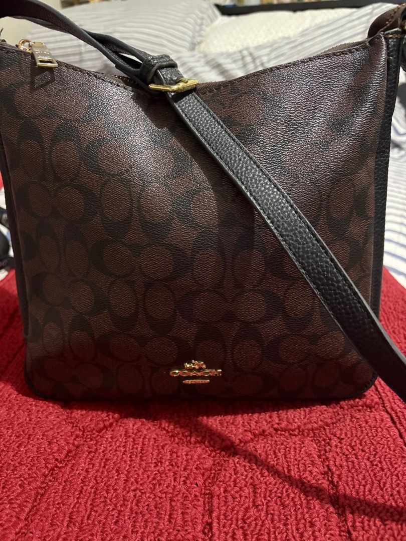 Val Duffle Bag In Signature Canvas (Category: Shoulder Bags) located in San Juan City. Submitted by quickpenguin.0016e7 (Listing ID 1387264284, Image 1). Description: Val Duffle Bag In Signature Leather Trims Color: Gold / Walnut Black Bag Width: Medium (9”) Refined pebble leather| Signature coated canvas and refined pebble leather| Inside zip, cell phone and multifunction pockets| Zip-top closure, fabric lining| Outside zip pocket| Adjustable st