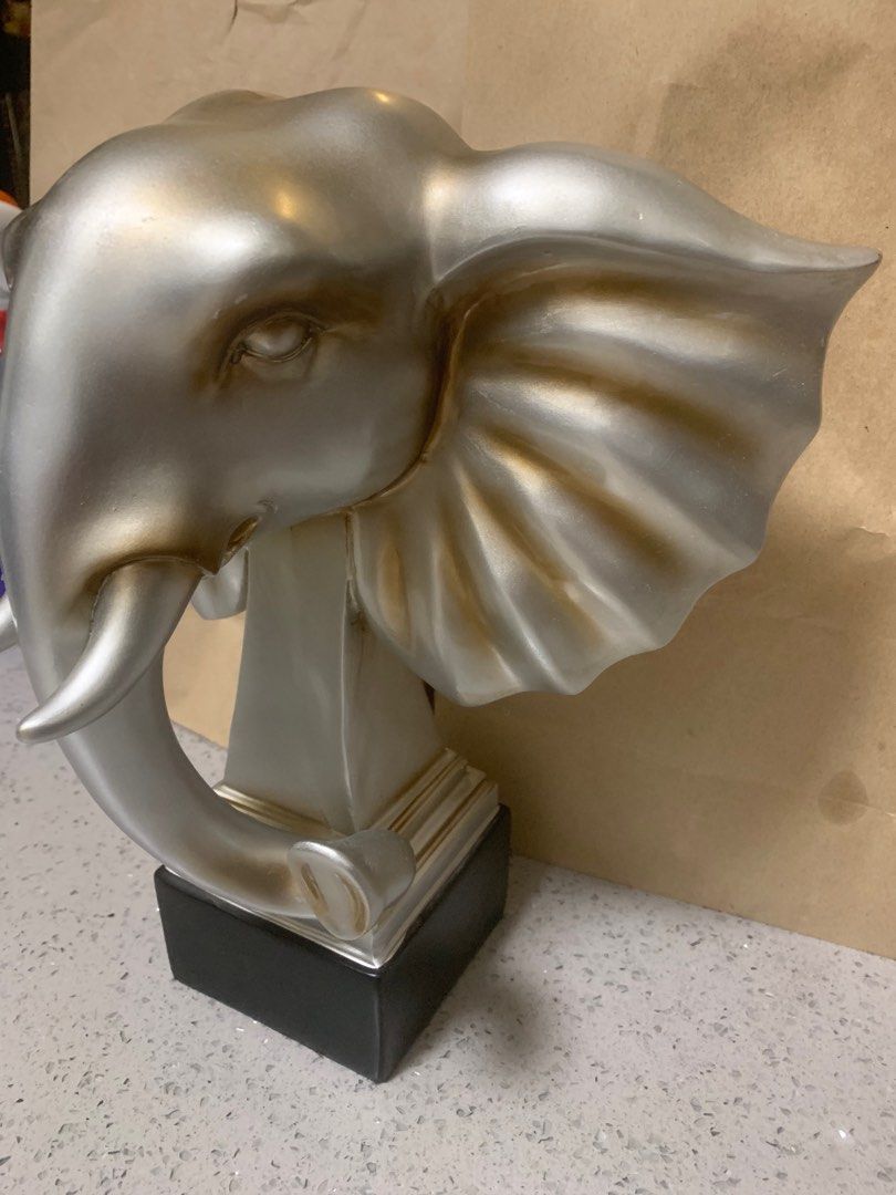 12” Silver Elephant Head Sculpture – Elegant Home Décor Accent (Category: Wall Decor) located in Bacoor. Submitted by pipsniper (Listing ID 1387405377, Image 3). Description: Bring strength, wisdom, and elegance into your space with this striking 12-inch silver elephant head sculpture. Crafted from durable resin with a sleek metallic silver finish and subtle golden undertones, it makes a bold decorative statement while symbolizing good fortune an