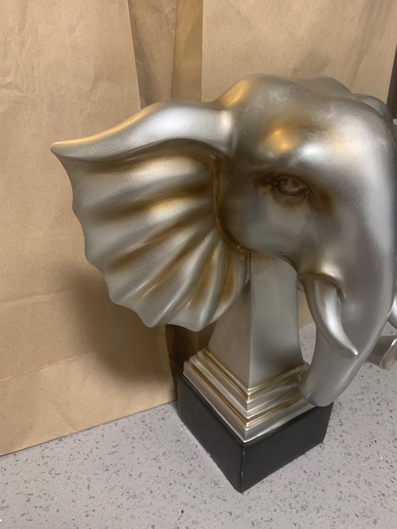 12” Silver Elephant Head Sculpture – Elegant Home Décor Accent (Category: Wall Decor) located in Bacoor. Submitted by pipsniper (Listing ID 1387405377, Image 2). Description: Bring strength, wisdom, and elegance into your space with this striking 12-inch silver elephant head sculpture. Crafted from durable resin with a sleek metallic silver finish and subtle golden undertones, it makes a bold decorative statement while symbolizing good fortune an