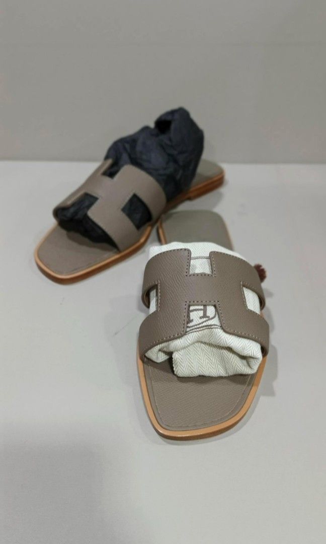 Authentic Hermes Oran Epsom Taupe With Authenticity Documents and Box (Category: Sneakers & Footwear) located in La Trinidad. Submitted by designerluxeshop (Listing ID 1374034447, Image 1). Description: Pre-owned Hermes Oran epsom taupe with authenticity documents and box size 38, 💯% guaranteed original, in good condition, shipping is free, message me if interested, delivery is ready, onhand discount is offered for cash buyer layaway is accepted
