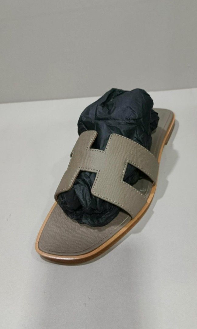 Authentic Hermes Oran Epsom Taupe With Authenticity Documents and Box (Category: Sneakers & Footwear) located in La Trinidad. Submitted by designerluxeshop (Listing ID 1374034447, Image 2). Description: Pre-owned Hermes Oran epsom taupe with authenticity documents and box size 38, 💯% guaranteed original, in good condition, shipping is free, message me if interested, delivery is ready, onhand discount is offered for cash buyer layaway is accepted
