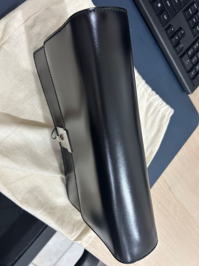 Gucci Clutch Bag (Category: Luxury Bags & Wallets) located in Quezon City. Submitted by juvyjuvydoo (Listing ID 1387474723, Image 3). Description: Gucci Hand Bag / Clutch Bag with dustbag and what appears to be a key Unisex (But I think its for Men) Bought from a Japan based seller (Pasabuy) in 2023 but only stored it in the cabinet. It was bought preowned. With minor scratch on the front, I have not tried anything to try to remove it. The scratc