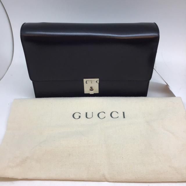 Gucci Clutch Bag (Category: Luxury Bags & Wallets) located in Quezon City. Submitted by juvyjuvydoo (Listing ID 1387474723, Image 1). Description: Gucci Hand Bag / Clutch Bag with dustbag and what appears to be a key Unisex (But I think its for Men) Bought from a Japan based seller (Pasabuy) in 2023 but only stored it in the cabinet. It was bought preowned. With minor scratch on the front, I have not tried anything to try to remove it. The scratc