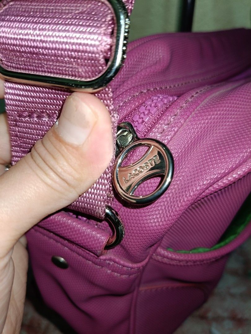 PreLoved Lacoste Sling Bag in Magenta (Category: Cross-body Bags) located in Paranaque City. Submitted by mscath.varietyshop (Listing ID 1387436663, Image 2). Description: wysiwyg as is actual photos posted flaws indicated in photos(if any).