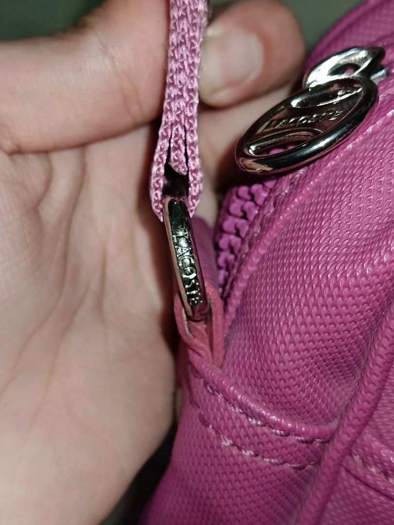 PreLoved Lacoste Sling Bag in Magenta (Category: Cross-body Bags) located in Paranaque City. Submitted by mscath.varietyshop (Listing ID 1387436663, Image 3). Description: wysiwyg as is actual photos posted flaws indicated in photos(if any).