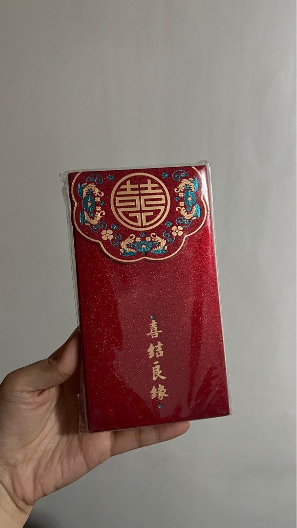 Wedding Angpao / wedding money envelope / wedding red envelope (Category: Wallets & Card holders) located in Quezon City. Submitted by MyClosetCapsule (Listing ID 1387425270, Image 3). Description: 30 pesos / per piece only. 8pcs Available With tassle. Red envelope or Angpao for weddings. Character written for Happy Marriage. Same-day pickup ok! Rfs: Bought as set, only needed 1 as wedding gift. .