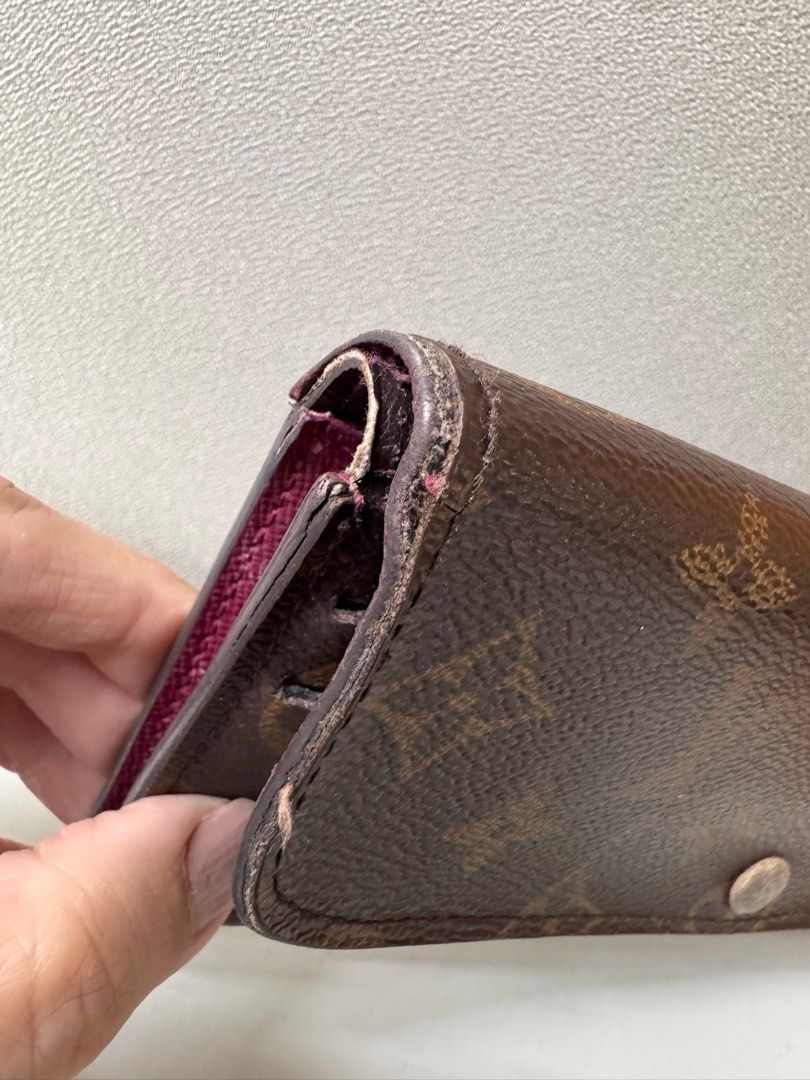 AUTHENTIC Louis Vuitton Emilie Wallet in Monogram Canvas (Category: Luxury Bags & Wallets) located in Makati City. Submitted by makayshoppe (Listing ID 1387596552, Image 2). Description: Well used but still gorgeous LV Emilie wallet, with initials. Guaranteed authentic, purchased years ago in LV Greenbelt. Leather is okay, no cracking in the inside pockets, no sticky pockets. Obvious signs of daily usage, minor stitches on the side are coming off