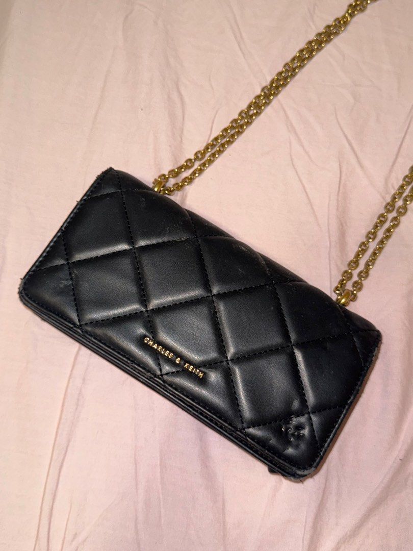 CHARLES & KEITH Paffuto Chain Handle Quilted Long Wallet - Black (Category: Luxury Bags & Wallets) located in Quezon City. Submitted by biuesides (Listing ID 1387673452, Image 2). Description: Paffuto Chain Handle Quilted Long Wallet - Black negotiable with flaws — check pics still can be used during night outs ! dinners.