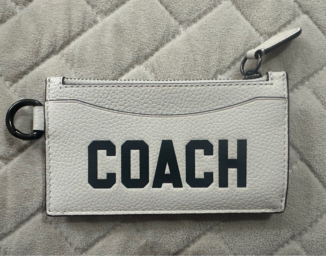 COACH ZIP CARD CASE WITH VARSITY MOTIF WHITE (Category: Purses & Pouches) located in Quezon City. Submitted by jaaaane (Listing ID 1387693631, Image 1). Description: Coach Zip Card Case Bought in Japan (almost 8K) Used only twice Inclusion: dustbag only RFS: Decluttering.