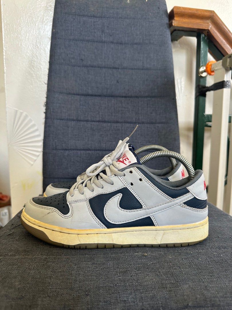 Nike Dunk Low College Navy Wolf Grey (Category: Sneakers) located in Quezon City. Submitted by jesscagungun (Listing ID 1387604902, Image 1). Description: Ukay bale po ito from US, so it needs cleaning. What you see is what you get. Nasa picture na po lahat ng details, thank you..
