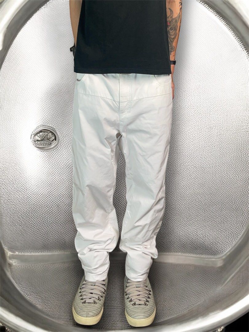 Ss2013 Undercover white double layered cotton trousers (Category: Activewear) located in Manila. Submitted by killzarchival (Listing ID 1387732110, Image 2). Description: Ss2013 Undercover white double layered cotton trousers *Condi:7/10 *Button bleed onto the crotch area but overall the pants is still in good condition with normal sign of using Size:4 Waist:34 Outseam:41 Inseam:29.5 Crotch:12 Thigh:12.5 Knee:9.5 Leg opening:7.5.