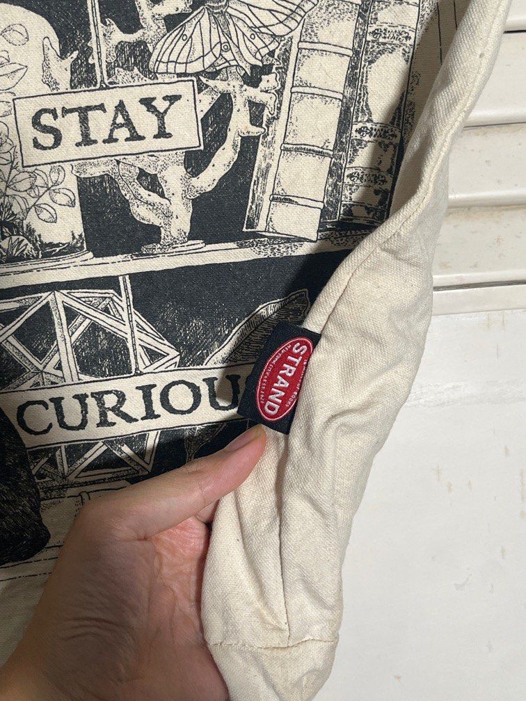 strand bookstore NY tote bag (Category: Tote Bags) located in Pasig City. Submitted by joey_b (Listing ID 1387670590, Image 3). Description: as is. some stains. can maybe we washed out 🤷🏽‍♀️ purchased from the Strand bookstore in New York pocket and zipper close.