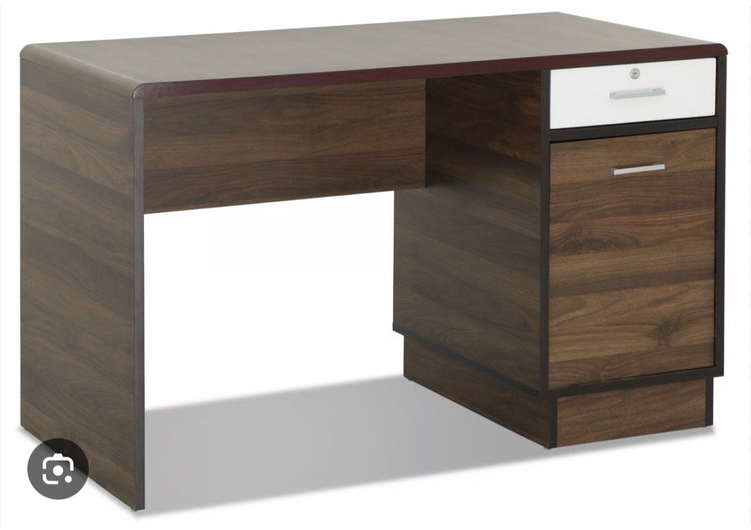 Study table lightly used (Category: Tables & Sets) located in Singapore. Submitted by preetiagg (Listing ID 1387556299, Image 1). Description: Walnut color. Barely used. Just used for storing things in cabinet. Bought in 2023.