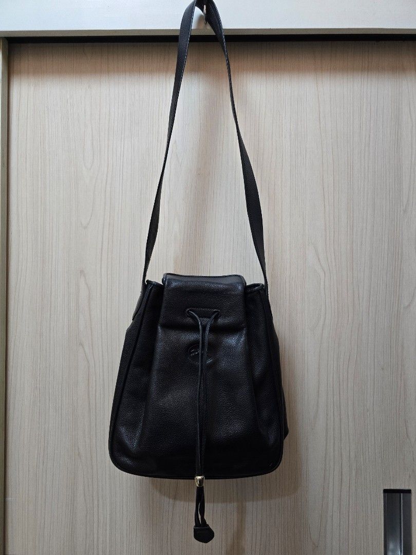 Vintage Longchamp Bucket Bag (Category: Luxury Bags & Wallets) located in Baguio. Submitted by prelovedbyolives (Listing ID 1387650620, Image 1). Description: Selling my thrifted vintage longchamp bucket bag..hard to let go but i'm thinking of buying another bag so I need to let her go..i also bought this here at carousell a couple of years ago.. Pros -classic, vintage and rare piece -leather is in excellent condition Flaws -interior has cracks d