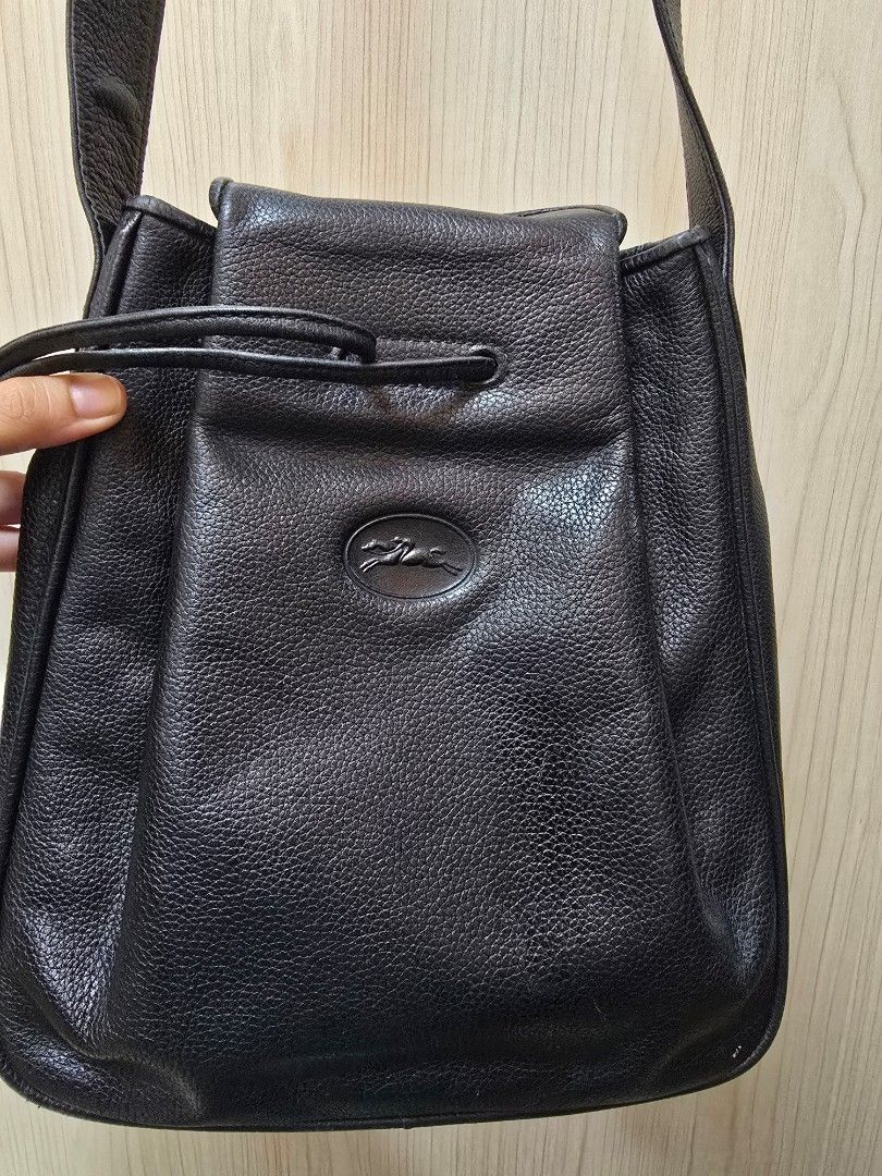 Vintage Longchamp Bucket Bag (Category: Luxury Bags & Wallets) located in Baguio. Submitted by prelovedbyolives (Listing ID 1387650620, Image 2). Description: Selling my thrifted vintage longchamp bucket bag..hard to let go but i'm thinking of buying another bag so I need to let her go..i also bought this here at carousell a couple of years ago.. Pros -classic, vintage and rare piece -leather is in excellent condition Flaws -interior has cracks d