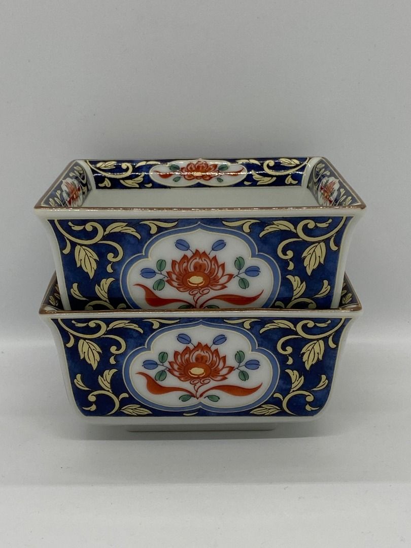 Vintage Set of Two Square Intricately Decorated Imari Ware Kozan Kiln Bowls Made in Japan with Maker's Mark (Category: Dinnerware & Cutlery) located in Cheras. Submitted by koorates (Listing ID 1387696030, Image 2). Description: This is a set of two Japanese Imari ware square bowls from the Kozan kiln. These bowls are made of porcelain and originated from Arita, Japan. They are believed to have been made in the 1990s. The bowls feature a distinct