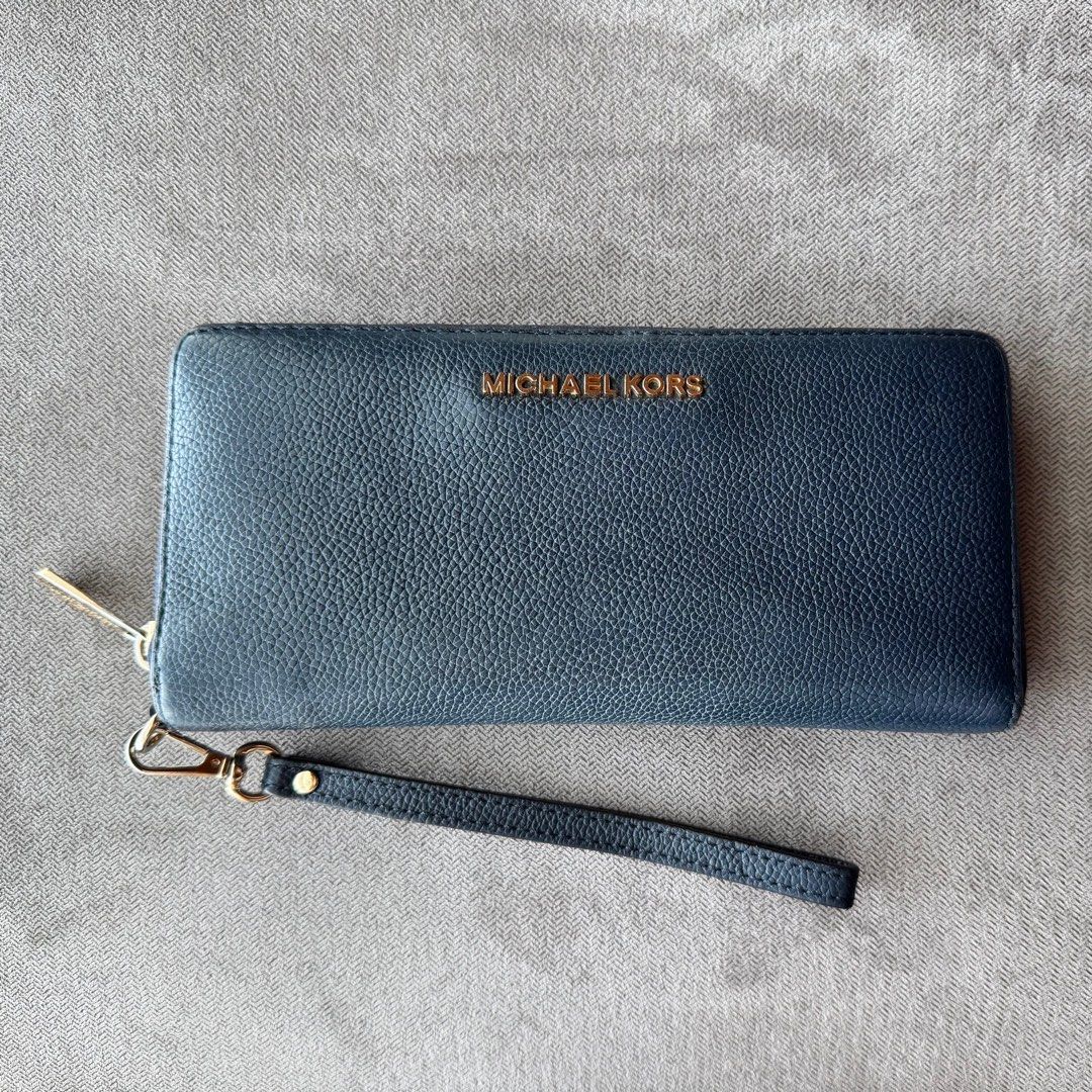 Preloved MK Jet Set Large Continental Wallet Wristlet (Category: Luxury Bags & Wallets) located in Quezon City. Submitted by __J__ (Listing ID 1384293225, Image 1). Description: Original price: $298 Preloved original Michael Kors pebbled leather zip around long wallet. Michael Kors Logo at Front Zip Around Closure Custom Fabric Lining 16 Card Slots, ID Window 3 Multi-Function Compartment 8.25”(L) X 4”(H) X 1”(D) 8” Removable Strap Condition: Used