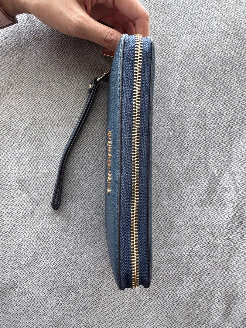Preloved MK Jet Set Large Continental Wallet Wristlet (Category: Luxury Bags & Wallets) located in Quezon City. Submitted by __J__ (Listing ID 1384293225, Image 2). Description: Original price: $298 Preloved original Michael Kors pebbled leather zip around long wallet. Michael Kors Logo at Front Zip Around Closure Custom Fabric Lining 16 Card Slots, ID Window 3 Multi-Function Compartment 8.25”(L) X 4”(H) X 1”(D) 8” Removable Strap Condition: Used