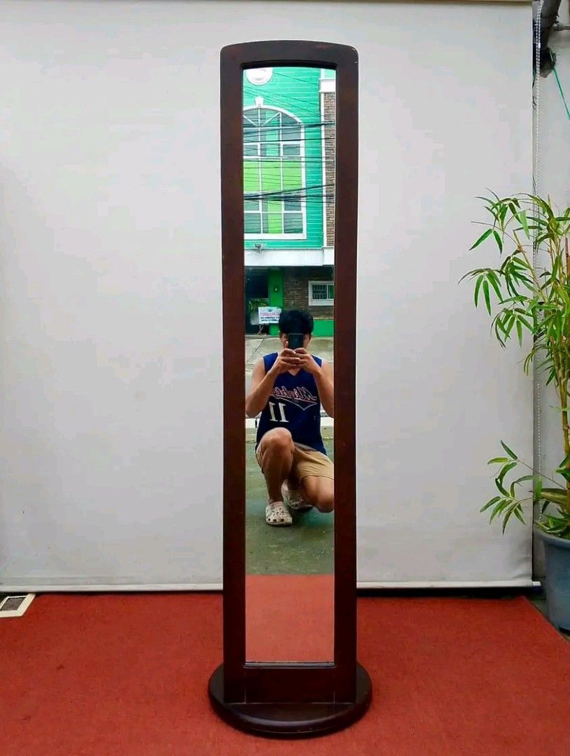 Solid Wood Rotating Mirror (Category: Mirrors) located in Quezon City. Submitted by matetdevis13 (Listing ID 1384369161, Image 2). Description: Solid Wood Rotating Mirror w/ Hanger Rack 18”L x 67”H Php 4k Solid wood In good condition.