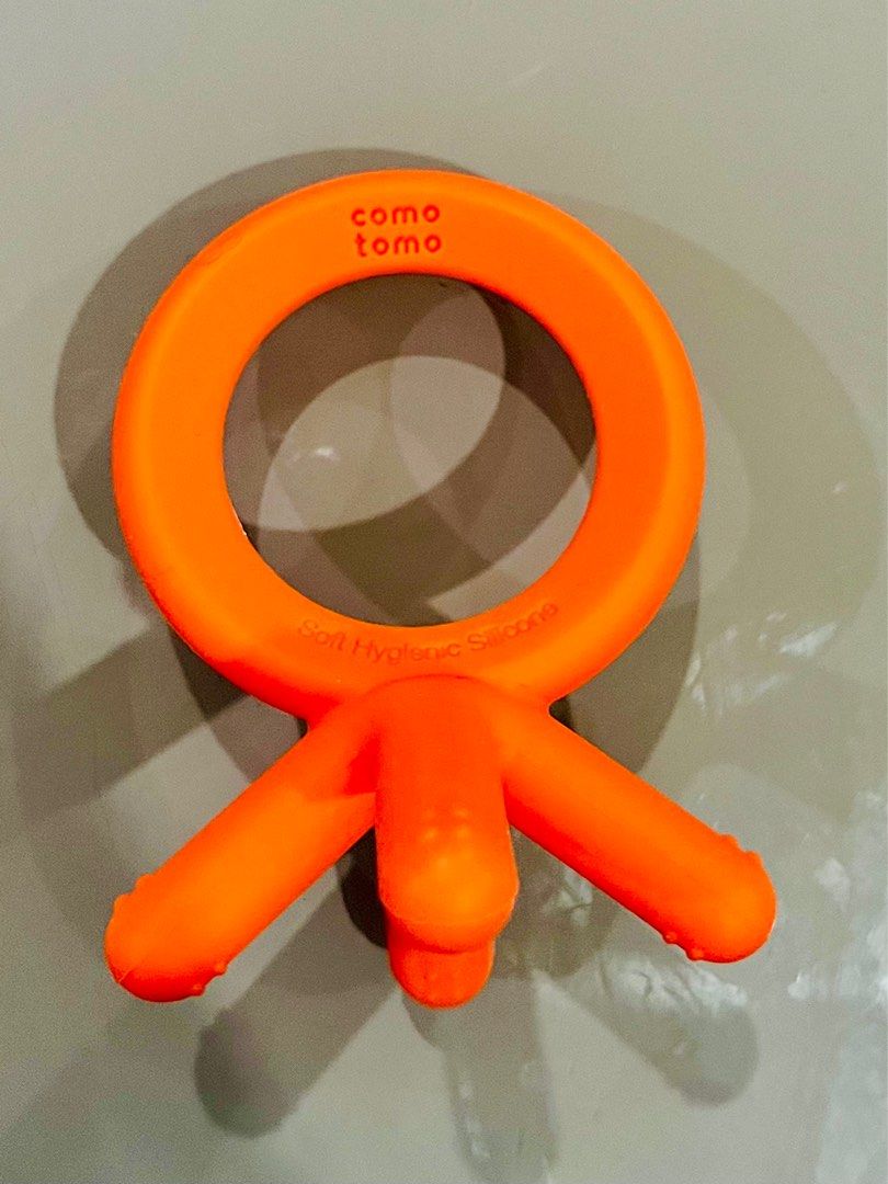 Comotomo Baby Silicone Teethers (Set of 2) (Category: Soothers & Pacifiers) located in Manila. Submitted by prelovedbycristinemargaux (Listing ID 1387922676, Image 3). Description: Selling both orange and blue as a set Lightly Used; No signs of usage DESCRIPTION: Comotomo Silicone teethers are designed to mimic those little baby fingers and are made with hygienic silicone material that’s safe and oh so perfectly chewy. The teethers are designed t
