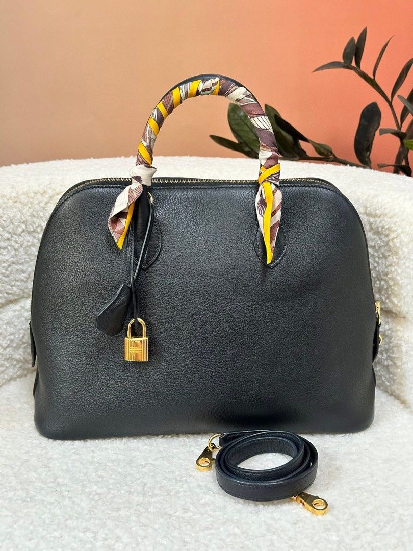 Authentic Hermes (Category: Luxury Bags & Wallets) located in Manila. Submitted by chloe_luxuries (Listing ID 1387890149, Image 1). Description: Guaranteed Original Hermes Bollide 30 in Gold hardware color Black Still in very good condition Comes with dustbag strap lock and keys Pm for those interested .