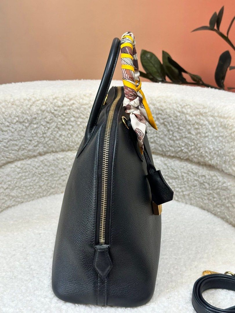 Authentic Hermes (Category: Luxury Bags & Wallets) located in Manila. Submitted by chloe_luxuries (Listing ID 1387890149, Image 3). Description: Guaranteed Original Hermes Bollide 30 in Gold hardware color Black Still in very good condition Comes with dustbag strap lock and keys Pm for those interested .