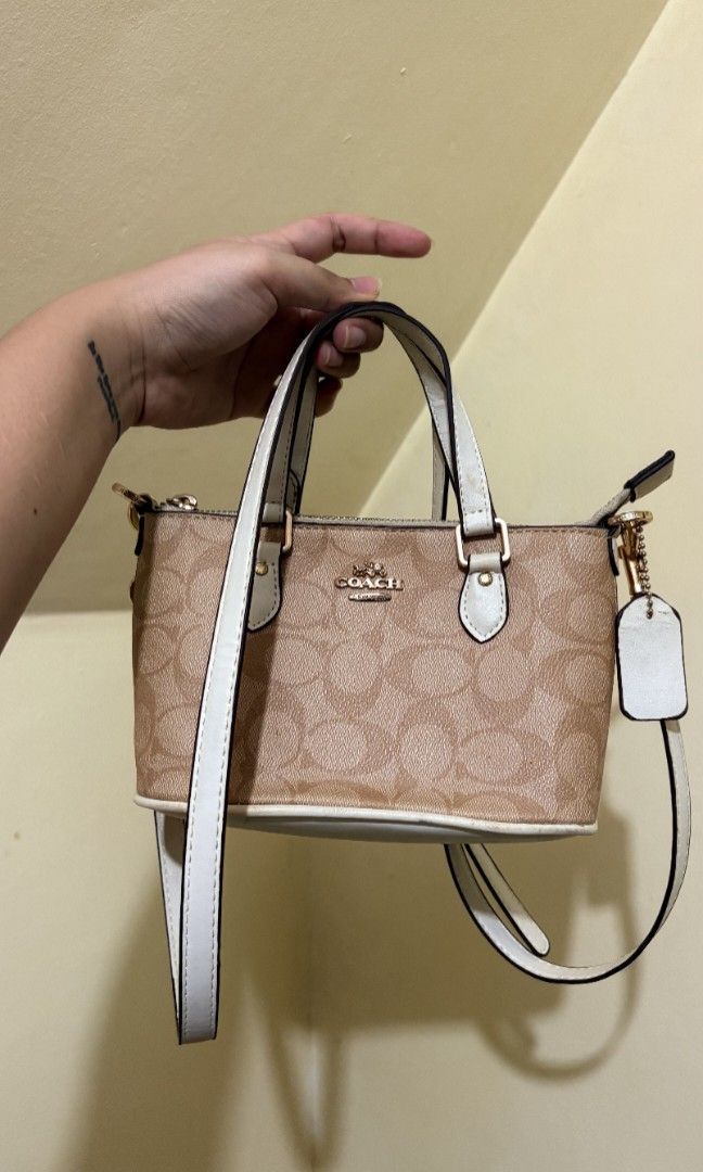 Coach white mini tote bag (Category: Luxury Bags & Wallets) located in Manila. Submitted by cjamesss (Listing ID 1387906870, Image 1). Description: can give discount to sure buyer stains on handle and sling see picture can do meet up around maginhawa QC or cubao area.