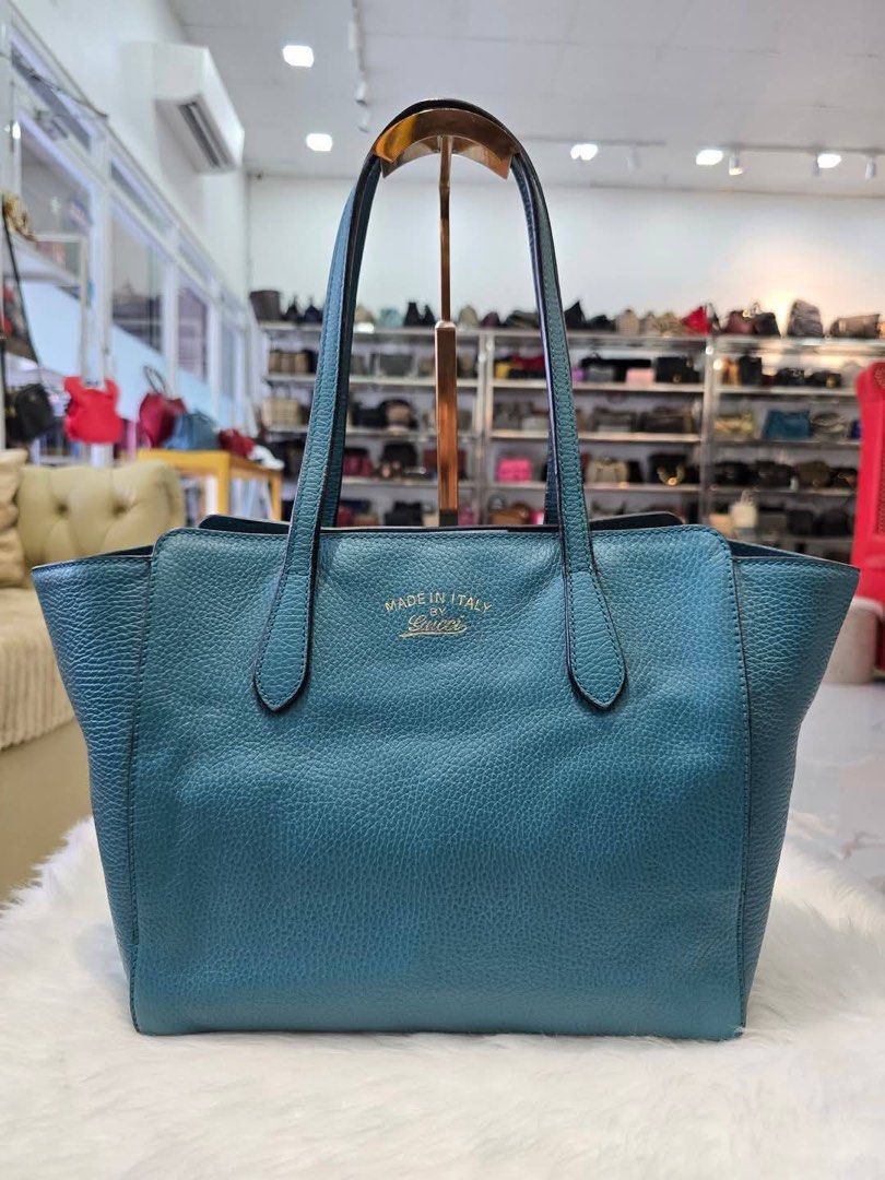 Gucci Swing Tote (Category: Luxury Bags & Wallets) located in Manila. Submitted by SecondhandItems97 (Listing ID 1387853189, Image 2). Description: Medium size With organizer W/generic dustbag only.