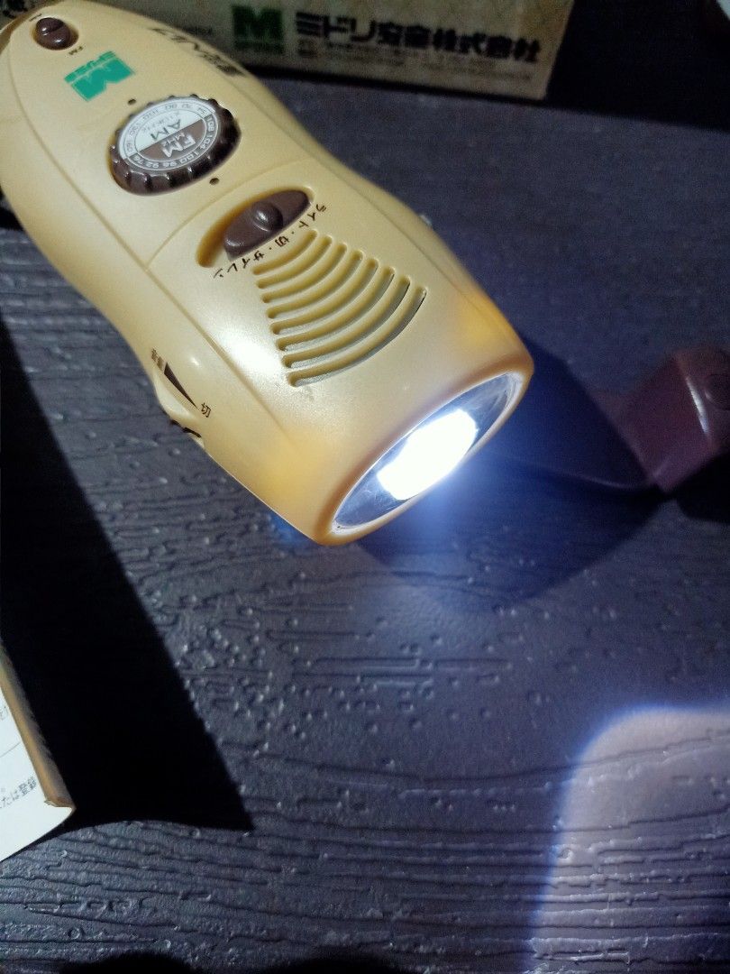 Hand winding radio flashlight (Category: Portable Music Players) located in Las Pinas. Submitted by the_recycle_shop (Listing ID 1387878772, Image 3). Description: Item from Japan Manual hand winding to recharge Good working condition Am fm radio siren blinker.